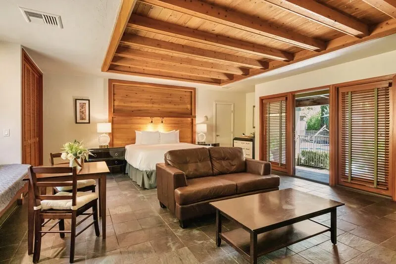 A poolside king room opening onto the terraced gardens