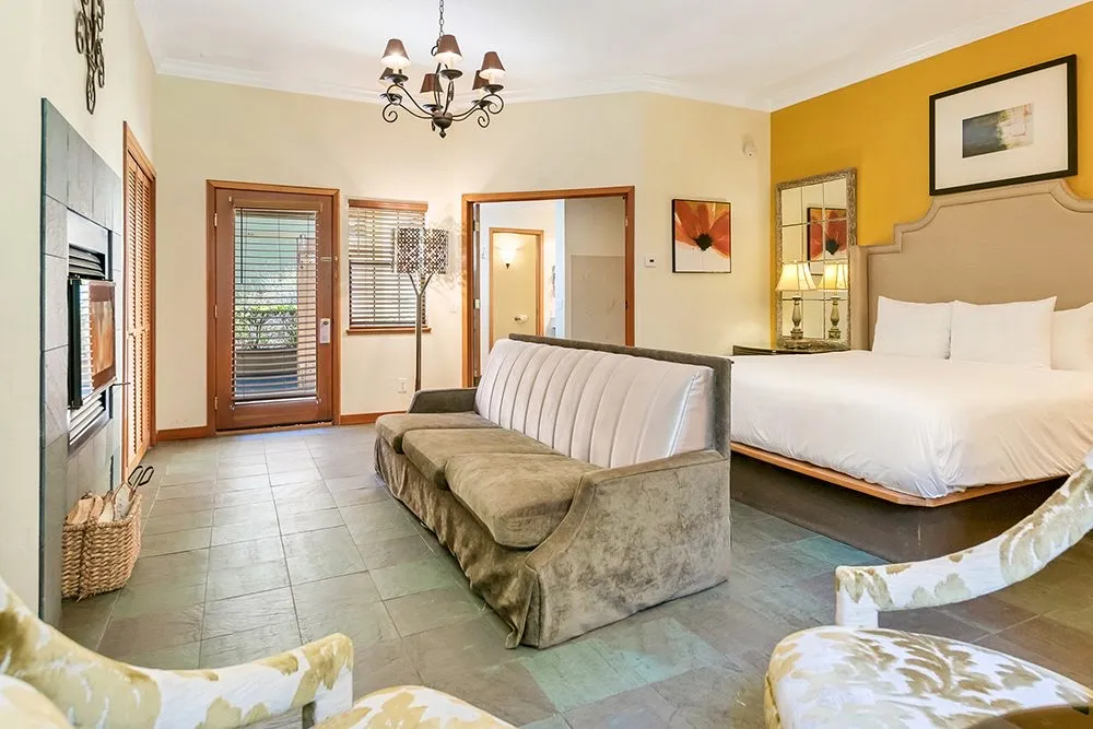 A room with two king beds and a seating area