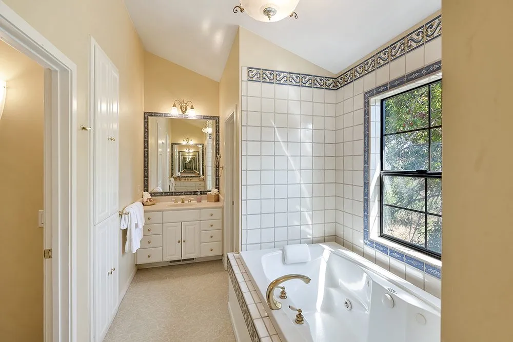A poolside room with garden access